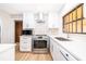 Stylish kitchen with stainless steel appliances, bright lighting, and tiled backsplash at 2814 Conway Gardens Rd, Orlando, FL 32806