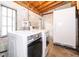 Bright laundry room features a washer, dryer and refrigerator at 2814 Conway Gardens Rd, Orlando, FL 32806