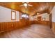 Living room with unique wood features, hardwood floors, and a ceiling fan at 2814 Conway Gardens Rd, Orlando, FL 32806