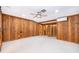 Finished basement with wood paneling and a closet at 2814 Conway Gardens Rd, Orlando, FL 32806