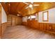 Living room with unique wood features, hardwood floors, and built-in shelving at 2814 Conway Gardens Rd, Orlando, FL 32806