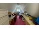Attic bedroom in A-frame home featuring a unique layout and sloped ceilings at 283 Oak Ln, New Smyrna Beach, FL 32168