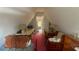 Attic bedroom in A-frame home featuring sloped ceilings and a quirky layout at 283 Oak Ln, New Smyrna Beach, FL 32168