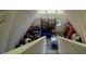 Open layout living room with high ceilings viewed from the top of the staircase at 283 Oak Ln, New Smyrna Beach, FL 32168