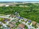 Aerial view of the community homes with lush landscaping and ponds at 2926 Boating Blvd, Kissimmee, FL 34746