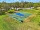 Aerial shot of the community basketball court surrounded by green space at 2926 Boating Blvd, Kissimmee, FL 34746