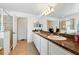 Bathroom with double sinks, granite countertops, and a walk-in shower at 2926 Boating Blvd, Kissimmee, FL 34746