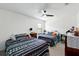 Bedroom featuring two beds with unique patterned bedding and neutral walls at 2926 Boating Blvd, Kissimmee, FL 34746