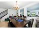 Elegant dining room with chandelier, table setting, and easy access to other rooms at 2926 Boating Blvd, Kissimmee, FL 34746
