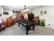 Large game room featuring a pool table, bar, and a red mini fridge at 2926 Boating Blvd, Kissimmee, FL 34746