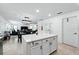 Open concept kitchen and dining area, featuring a central island with storage at 2926 Boating Blvd, Kissimmee, FL 34746