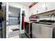 Laundry room with washer, dryer, cabinets, and access to the garage at 2926 Boating Blvd, Kissimmee, FL 34746