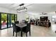 Open-concept living area with dining space and sliding glass doors to a patio at 2926 Boating Blvd, Kissimmee, FL 34746