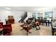 Cozy living room featuring tile flooring, dining area, and staircase at 2926 Boating Blvd, Kissimmee, FL 34746