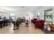 Bright living area with tile flooring, dining set, and comfortable seating arrangements at 2926 Boating Blvd, Kissimmee, FL 34746