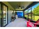 View of the screened in patio with a ceiling fan and outdoor furniture at 2926 Boating Blvd, Kissimmee, FL 34746