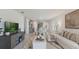 Open-concept living space blending kitchen, dining, and living areas for a seamless flow and modern living at 2959 Waterlily Way, Poinciana, FL 34759