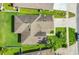 Birds-eye view of a single-Gathering home featuring a well-maintained roof and green lawn at 2975 White Cedar Cir, Kissimmee, FL 34741