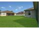 Manicured backyard showcases neighboring homes at 2975 White Cedar Cir, Kissimmee, FL 34741