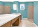 This bathroom features tile floors, a double vanity, and walk-in shower at 2975 White Cedar Cir, Kissimmee, FL 34741