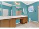 This bathroom features a double vanity, blue walls, and decorative anchor accents at 2975 White Cedar Cir, Kissimmee, FL 34741
