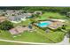 Community aerial view showcasing pool, playground, and landscaped common areas at 2975 White Cedar Cir, Kissimmee, FL 34741