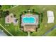 Aerial view showcasing the community pool, playground, and landscaped grounds at 2975 White Cedar Cir, Kissimmee, FL 34741