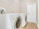 A conveniently located laundry room with modern appliances and ample space at 2975 White Cedar Cir, Kissimmee, FL 34741