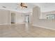 Bright living area featuring tile floors, a ceiling fan, and an open floor plan at 2975 White Cedar Cir, Kissimmee, FL 34741