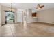 Spacious living room features tile flooring, abundant natural light, and an open layout at 2975 White Cedar Cir, Kissimmee, FL 34741