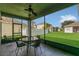 A screened-in patio provides views of the manicured backyard and adjacent homes at 2975 White Cedar Cir, Kissimmee, FL 34741
