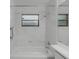 Clean bathroom featuring a tiled tub, shower, and a vanity for comfort and convenience at 311 Lakebreeze Cir, Lake Mary, FL 32746