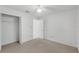 Bright bedroom with carpeted floors, a ceiling fan, and a large closet, perfect for relaxation at 311 Lakebreeze Cir, Lake Mary, FL 32746