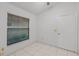 Comfortable bedroom with tile flooring, natural light, and ample space for relaxation at 311 Lakebreeze Cir, Lake Mary, FL 32746