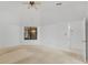 Large bedroom with carpet, ceiling fan, and a view to the ensuite bathroom at 311 Lakebreeze Cir, Lake Mary, FL 32746
