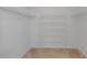 Walk-in closet offers shelving and hanging space, providing ample room for organizing clothes and accessories at 311 Lakebreeze Cir, Lake Mary, FL 32746