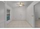 Bright dining area with tile flooring and ceiling fan, ideal for Gathering meals at 311 Lakebreeze Cir, Lake Mary, FL 32746