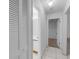 Hallway with tile flooring and access to the bathroom, closet, and additional rooms in the house at 311 Lakebreeze Cir, Lake Mary, FL 32746