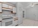 Kitchen featuring white cabinets and modern appliances providing a clean, functional design at 311 Lakebreeze Cir, Lake Mary, FL 32746
