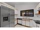 Updated kitchen with stainless steel refrigerator and plenty of cabinet space at 311 Lakebreeze Cir, Lake Mary, FL 32746