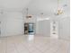 Expansive living area boasts tile floors, a ceiling fan, and an open layout at 311 Lakebreeze Cir, Lake Mary, FL 32746