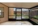 Screened patio offering serene views of the backyard and lush greenery, perfect for relaxing outdoors at 311 Lakebreeze Cir, Lake Mary, FL 32746