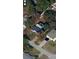 Aerial view of a home with mature trees and a large, partially fenced yard in a residential neighborhood at 3146 Byington Terrace Ter, Deltona, FL 32738