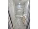 Well-lit bathroom featuring a bathtub/shower combination, vanity and marble-like tiling at 3146 Byington Terrace Ter, Deltona, FL 32738