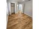 Bright bedroom features wood-look flooring, closet, and neutral paint palette at 3146 Byington Terrace Ter, Deltona, FL 32738