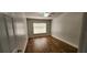 Bedroom with wood floors, ceiling fan, window and neutral colored walls at 3146 Byington Terrace Ter, Deltona, FL 32738