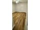 A modern bedroom features wood-look flooring, white walls, and double closet at 3146 Byington Terrace Ter, Deltona, FL 32738