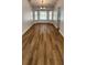 Bright dining room featuring a bay window, wood floors and modern light fixture at 3146 Byington Terrace Ter, Deltona, FL 32738