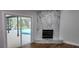 Marble fireplace with sliding door to backyard patio and pool area at 3146 Byington Terrace Ter, Deltona, FL 32738