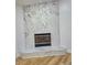 Modern fireplace with marble surround and gold trim accents at 3146 Byington Terrace Ter, Deltona, FL 32738